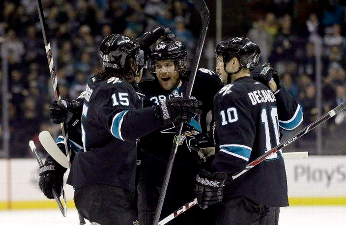 SAN JOSE, CA - JANUARY 02: Bracken Kearns #38 of the San Jose Sharks is congratulated by teammates after he scored a goal against the Edmonton Oilers at SAP Center on January 2, 2014 in San Jose, California. (Photo by Ezra Shaw/Getty Images)