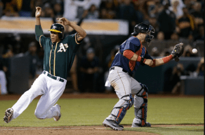 Kyle Blanks scores the go-ahead run in the eighth inning. The A's defested the Red Sox, 4-3. BEN MARGOT/AP