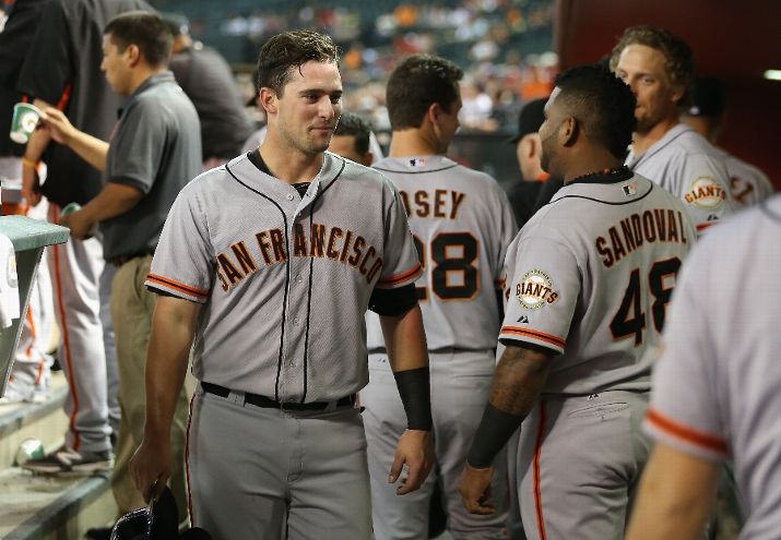 PHOENIX, AZ - SEPTEMBER 17: Andrew Susac #34 of the San Francisco Giants reacts in the dugout after scoring a second inning run against the Arizona Diamondbacks during the MLB game at Chase Field on September 17, 2014 in Phoenix, Arizona. (Photo by Christian Petersen/Getty Images)