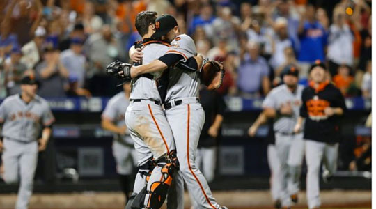 San Francisco Giants pither Chris Heston and Buster Posey embrace after Heston completes his no-hitter against the New York Mets