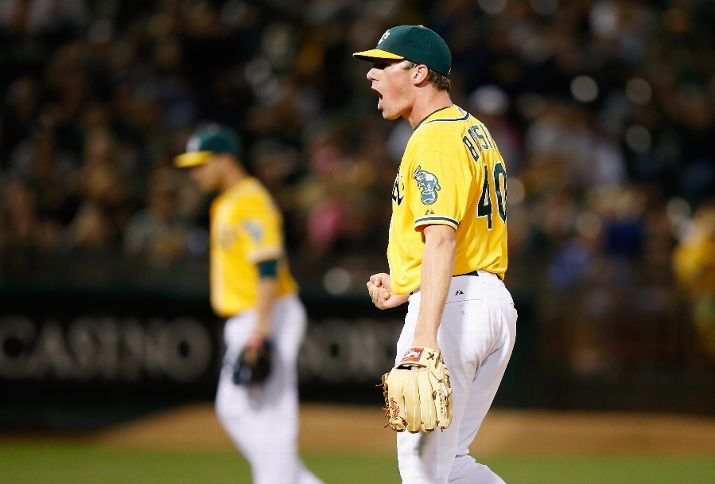 OAKLAND, CA - AUGUST 21: Chris Bassitt #40 of the Oakland Athletics reacts after the Athletics turned a double play to end the fifth inning against the Tampa Bay Rays at O.co Coliseum on August 21, 2015 in Oakland, California. (Photo by Ezra Shaw/Getty Images)